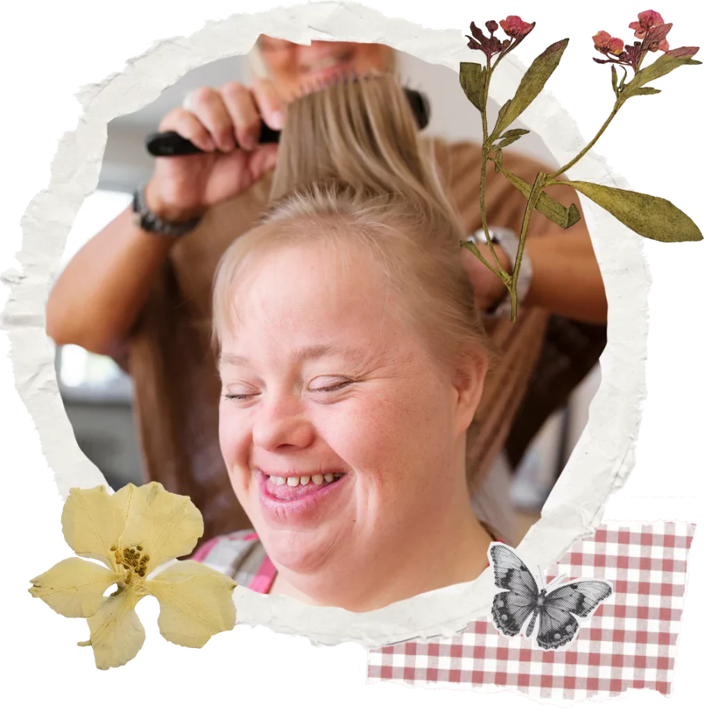 A disabled woman and her support worker doing her hair
